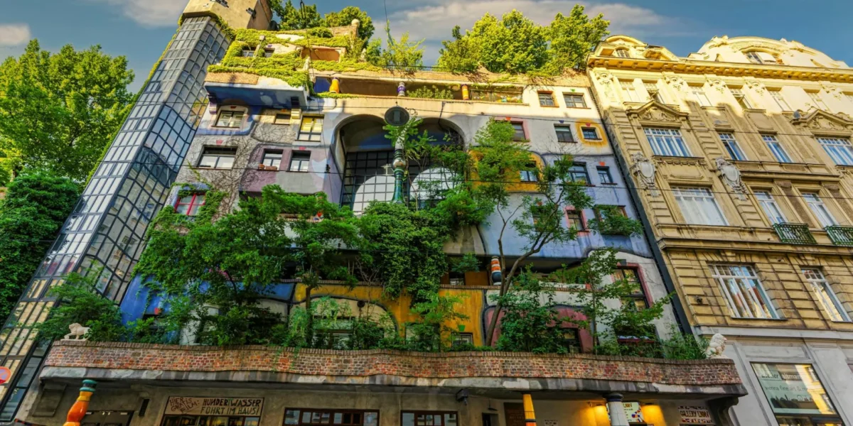 Colorful facade of the famous Hundertwasser House in Vienna, a unique architectural landmark with lush greenery.