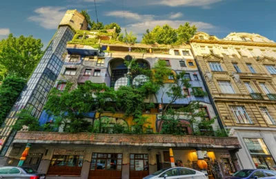 Colorful facade of the famous Hundertwasser House in Vienna, a unique architectural landmark with lush greenery.