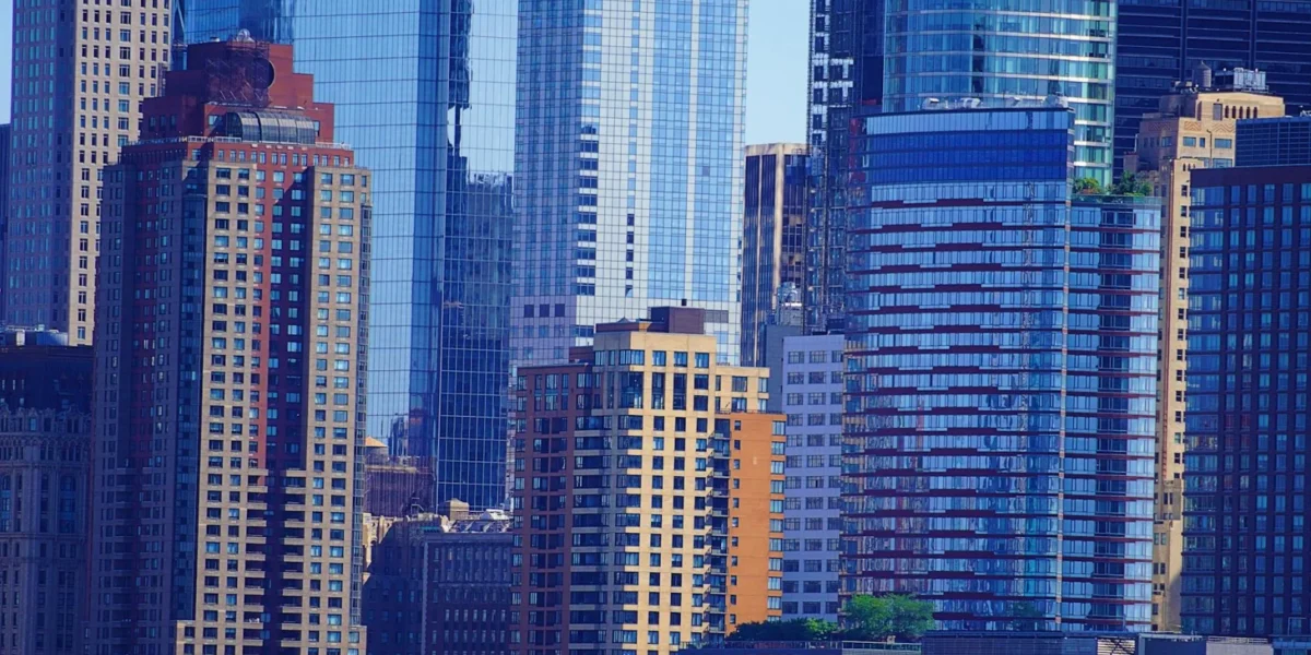 A stunning view of modern skyscrapers in New York City downtown district, highlighting urban architecture.