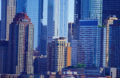 A stunning view of modern skyscrapers in New York City downtown district, highlighting urban architecture.