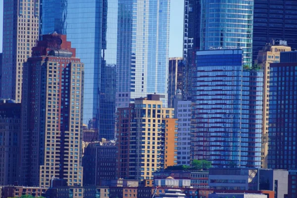 A stunning view of modern skyscrapers in New York City downtown district, highlighting urban architecture.