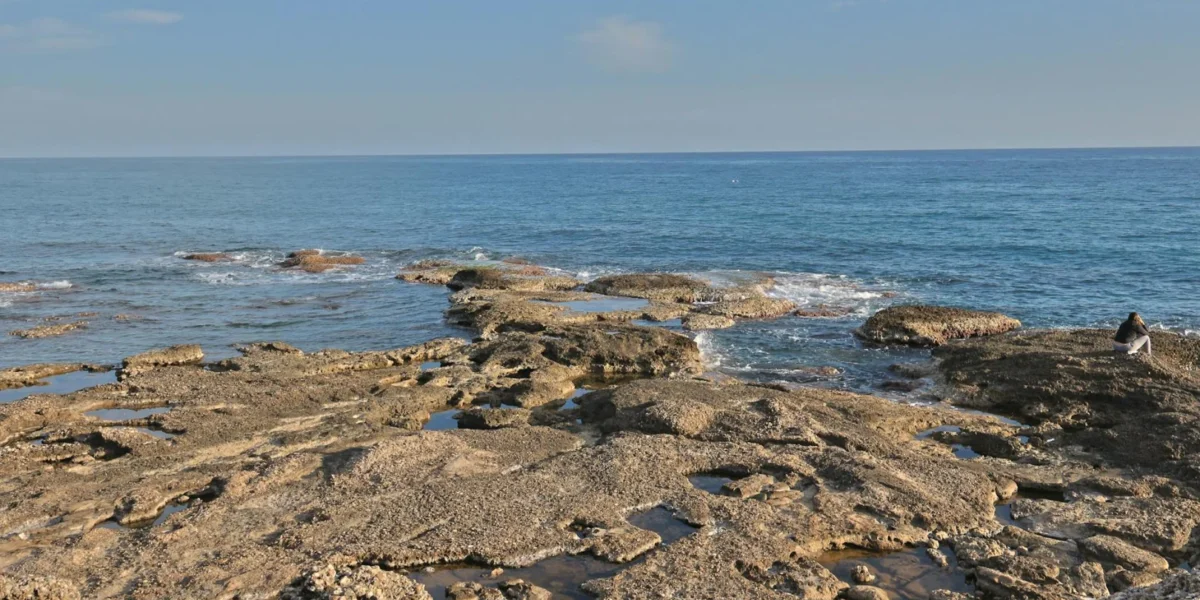 Explore the rocky coastline and azure waters in Side, Antalya, Türkiye, capturing the Mediterranean's serene beauty.