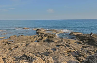 Explore the rocky coastline and azure waters in Side, Antalya, Türkiye, capturing the Mediterranean's serene beauty.