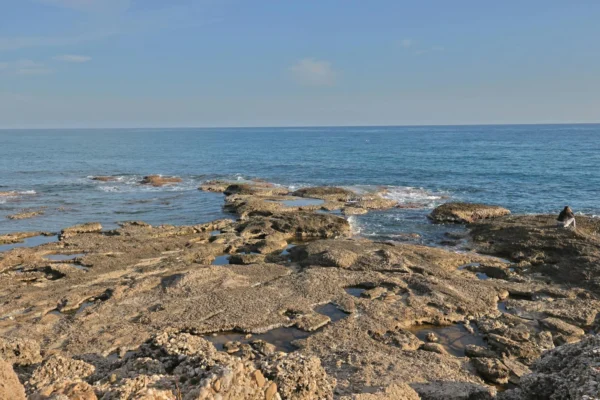 Explore the rocky coastline and azure waters in Side, Antalya, Türkiye, capturing the Mediterranean's serene beauty.