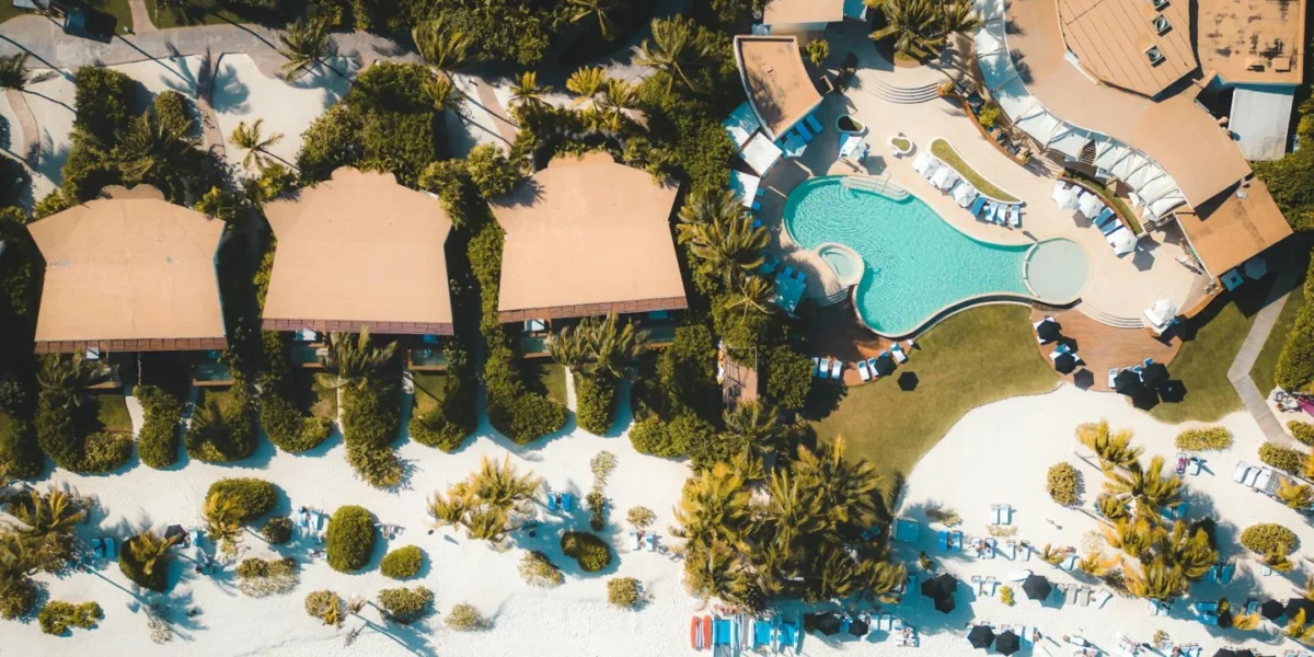 Explore a luxury tropical resort in Playa del Carmen with stunning views of the beach and swimming pool.