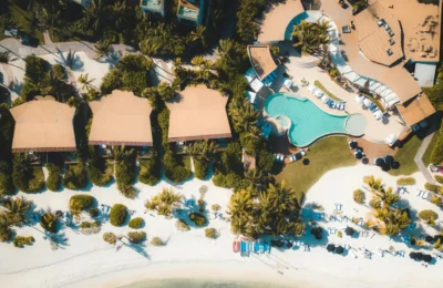 Explore a luxury tropical resort in Playa del Carmen with stunning views of the beach and swimming pool.