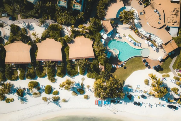 Explore a luxury tropical resort in Playa del Carmen with stunning views of the beach and swimming pool.