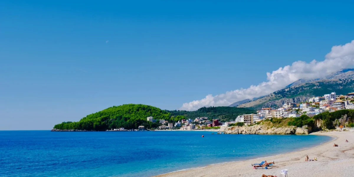 Beautiful Himarë beach in Albania with stunning blue waters and coastal landscape.