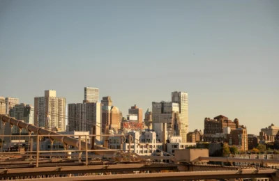 Explore the iconic skyline of New York City captured from Brooklyn Bridge, showcasing urban architecture and vibrant city life.