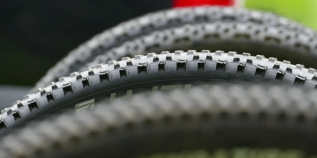Detailed close-up of mountain bike tires showcasing tread design for off-road cycling.