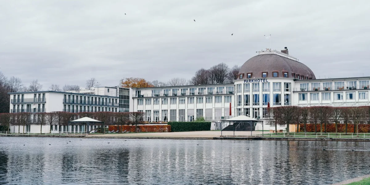 Scenic view of Parkhotel near a tranquil lake in Bremen, Germany.
