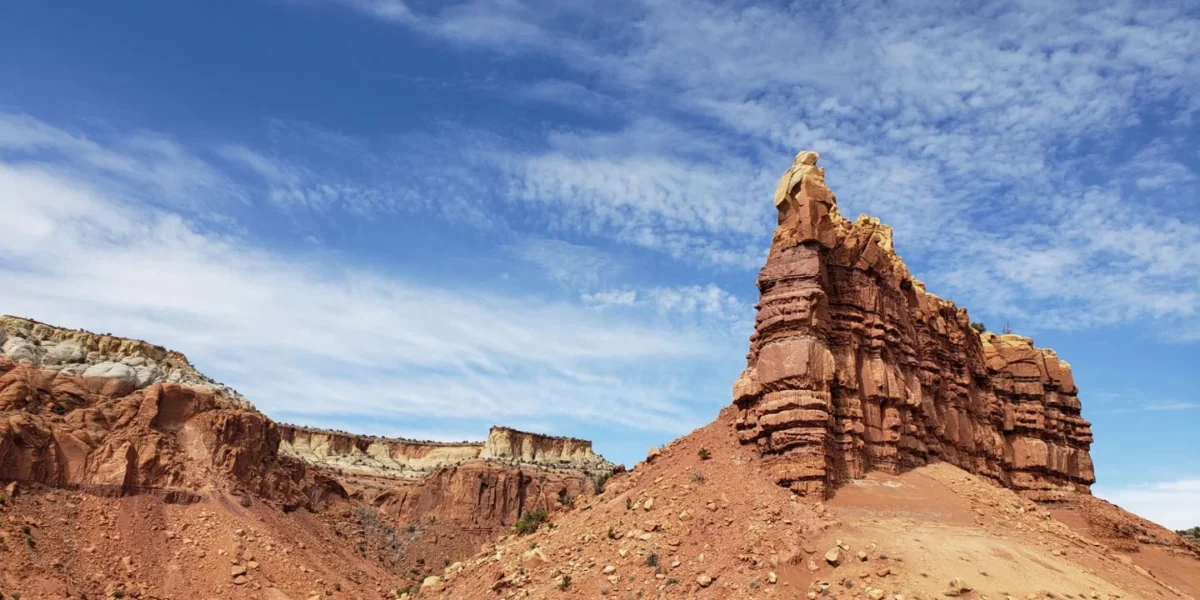 Scenic view of towering rock formations under a bright blue sky in Gallina, NM, USA.