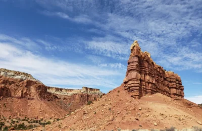 Scenic view of towering rock formations under a bright blue sky in Gallina, NM, USA.